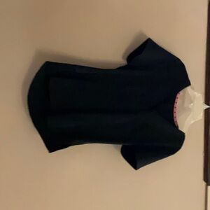 This black scrub top is used with pink and black hearts